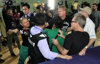 Teams battled and tempers flared at a workout today when the camps of Team Rios and Team Pacquiao crossed paths during training sessions Wednesday at The Venetian Macao Resort, Nov. 19, 2013.